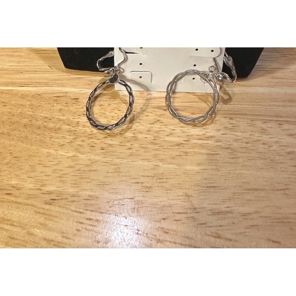 Very cute pair of vintage, silver earrings hoops.​​